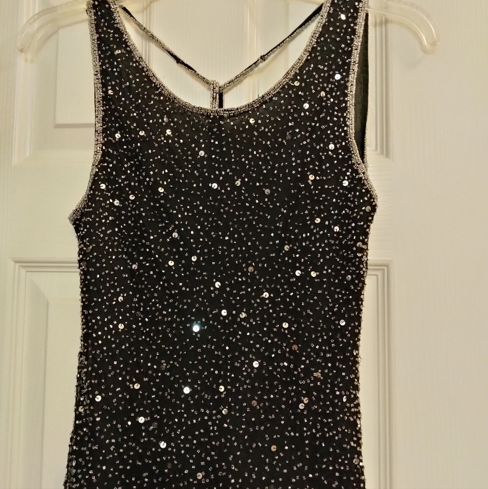 Stenay, sequence blouse.  She'll 100% Silk, Lining 100 Poly. Size- Medium.